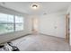 Bright bedroom with large window and neutral carpeting at 2821 Rialto Ct, Kissimmee, FL 34746