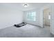 Bright bedroom with large window and neutral carpeting at 2821 Rialto Ct, Kissimmee, FL 34746