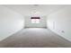 Spacious bedroom with neutral carpeting and large window at 2821 Rialto Ct, Kissimmee, FL 34746