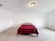 Simple bedroom with a bed and neutral decor at 2821 Rialto Ct, Kissimmee, FL 34746