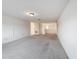 Spacious bedroom with neutral carpeting and large window at 2821 Rialto Ct, Kissimmee, FL 34746