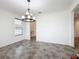 Dining room with chandelier and view into kitchen at 2821 Rialto Ct, Kissimmee, FL 34746