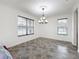 Spacious dining room with tiled floors and a chandelier at 2821 Rialto Ct, Kissimmee, FL 34746