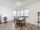 Dining room featuring a table with six chairs and large windows at 2821 Rialto Ct, Kissimmee, FL 34746
