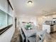 Open concept dining room with gray table and chairs at 2821 Rialto Ct, Kissimmee, FL 34746