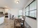 Spacious dining area with large windows and gray table at 2821 Rialto Ct, Kissimmee, FL 34746