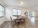 Bright dining room with grey table and six chairs at 2821 Rialto Ct, Kissimmee, FL 34746