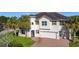 Two-story house with a two-car garage, and a nicely landscaped lawn at 2821 Rialto Ct, Kissimmee, FL 34746