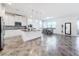 Kitchen with white cabinets, granite island, and dining area at 2821 Rialto Ct, Kissimmee, FL 34746