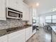 Sleek kitchen with granite countertops and stainless steel appliances at 2821 Rialto Ct, Kissimmee, FL 34746