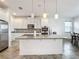 Kitchen island with granite countertop and stainless steel appliances at 2821 Rialto Ct, Kissimmee, FL 34746