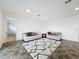 Open concept living room with comfortable couches and access to hallway at 2821 Rialto Ct, Kissimmee, FL 34746