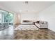 Bright living room with tiled floors, comfy sofas, and access to a screened patio at 2821 Rialto Ct, Kissimmee, FL 34746