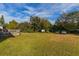 Large backyard with grassy area and trees at 2959 Old Dixie Hwy, Kissimmee, FL 34744