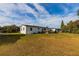 Large backyard with grassy area and deck at 2959 Old Dixie Hwy, Kissimmee, FL 34744