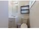 Small bathroom with toilet, sink, and mirror at 2959 Old Dixie Hwy, Kissimmee, FL 34744