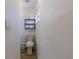 Small bathroom with toilet and floating shelf at 2959 Old Dixie Hwy, Kissimmee, FL 34744