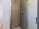 Shower stall with beige tiles and glass door at 2959 Old Dixie Hwy, Kissimmee, FL 34744