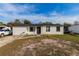 Newly renovated home with a white exterior and black accents at 2959 Old Dixie Hwy, Kissimmee, FL 34744