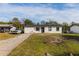 Newly renovated home with a white exterior and black accents at 2959 Old Dixie Hwy, Kissimmee, FL 34744