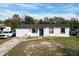 Newly renovated home with a white exterior and black accents at 2959 Old Dixie Hwy, Kissimmee, FL 34744