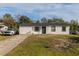 Newly renovated home with a white exterior and black accents at 2959 Old Dixie Hwy, Kissimmee, FL 34744