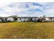 Rear view of a single story home with a deck at 2959 Old Dixie Hwy, Kissimmee, FL 34744
