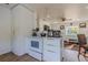 Clean galley kitchen with white cabinets and an eat-in area at 2959 Old Dixie Hwy, Kissimmee, FL 34744