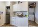 Small kitchen with white cabinets and stainless steel appliances at 2959 Old Dixie Hwy, Kissimmee, FL 34744