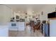 Open kitchen and dining area with white appliances at 2959 Old Dixie Hwy, Kissimmee, FL 34744