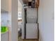 Stackable washer and dryer in a small laundry room at 2959 Old Dixie Hwy, Kissimmee, FL 34744