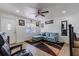 Bright living room featuring a comfortable sectional sofa and large TV at 2959 Old Dixie Hwy, Kissimmee, FL 34744