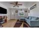 Bright living room featuring a comfortable sectional sofa and large TV at 2959 Old Dixie Hwy, Kissimmee, FL 34744