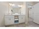 Double vanity bathroom with modern white cabinets at 3131 Paradox Cir # 401, Kissimmee, FL 34746