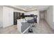 Modern kitchen with island, white cabinets, and stainless steel appliances at 3131 Paradox Cir # 401, Kissimmee, FL 34746