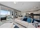 Spacious living room with white sectional sofa and lake view at 3131 Paradox Cir # 401, Kissimmee, FL 34746
