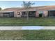 Backyard with grassy area and patio at 33 W Country Cove Way, Kissimmee, FL 34743