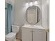 Well-lit bathroom with modern vanity, toilet, and shower at 33 W Country Cove Way, Kissimmee, FL 34743