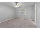Cozy bedroom featuring carpet flooring, ceiling fan, and a window providing natural light at 33 W Country Cove Way, Kissimmee, FL 34743