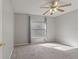 Bright bedroom featuring a ceiling fan and window with blinds at 33 W Country Cove Way, Kissimmee, FL 34743