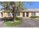 Charming exterior view of a well-maintained single-story home with assigned parking and beautiful landscaping at 33 W Country Cove Way, Kissimmee, FL 34743