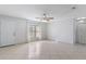 Spacious living room with tile flooring, ceiling fan, and a window offering natural light at 33 W Country Cove Way, Kissimmee, FL 34743