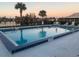 Tranquil community pool near a lake, perfect for relaxation at 33 W Country Cove Way, Kissimmee, FL 34743