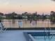 Community pool with lake view and warning sign at 33 W Country Cove Way, Kissimmee, FL 34743