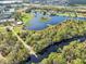 Aerial view of waterfront property with private dock access at 3412 Lake Diane Rd, Tavares, FL 32778