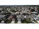 Aerial view of houses in a neighborhood with many solar panels at 507 Cassia Dr, Davenport, FL 33897