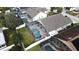 Aerial view of house with pool and screened enclosure at 507 Cassia Dr, Davenport, FL 33897