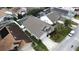 Aerial view of a house with gray roof and driveway at 507 Cassia Dr, Davenport, FL 33897