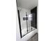 Bathroom with tub and frameless glass shower doors at 507 Cassia Dr, Davenport, FL 33897