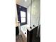 Bathroom with soaking tub, marble tile, and modern fixtures at 507 Cassia Dr, Davenport, FL 33897